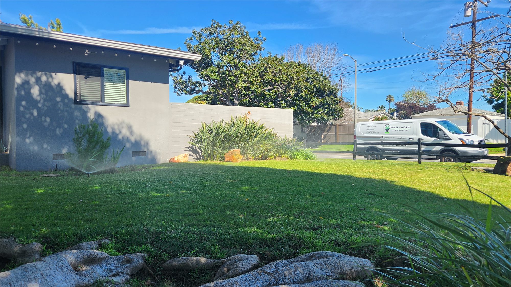 GreenWorks Landscaping service vehicle beside a maintained South Bay property